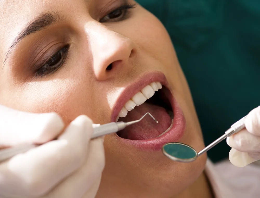 Dental professional conducting an oral examination